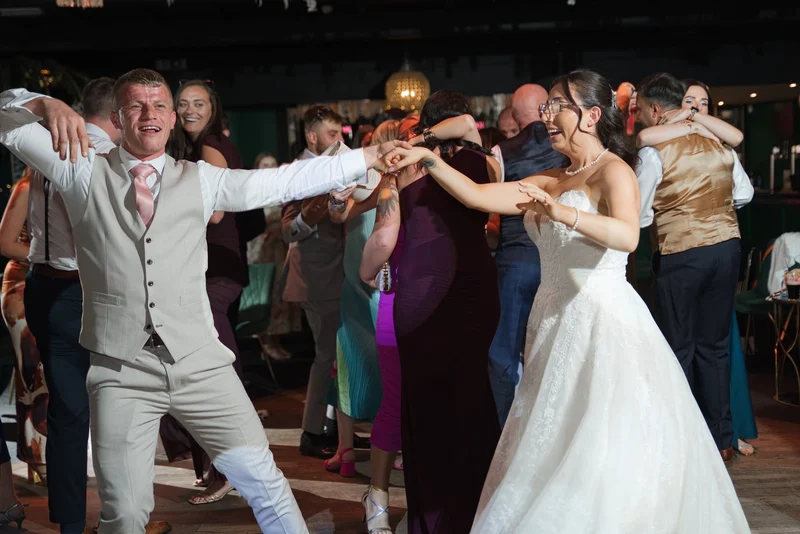 Androulla laughing and dancing at her wedding reception