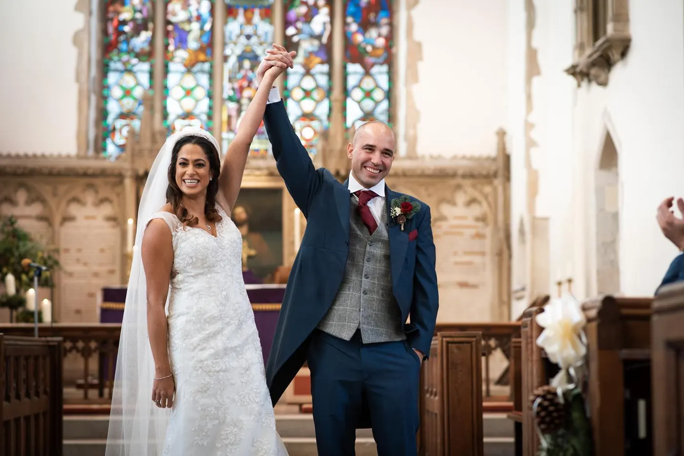 Couple celebrating at the altar just after being married