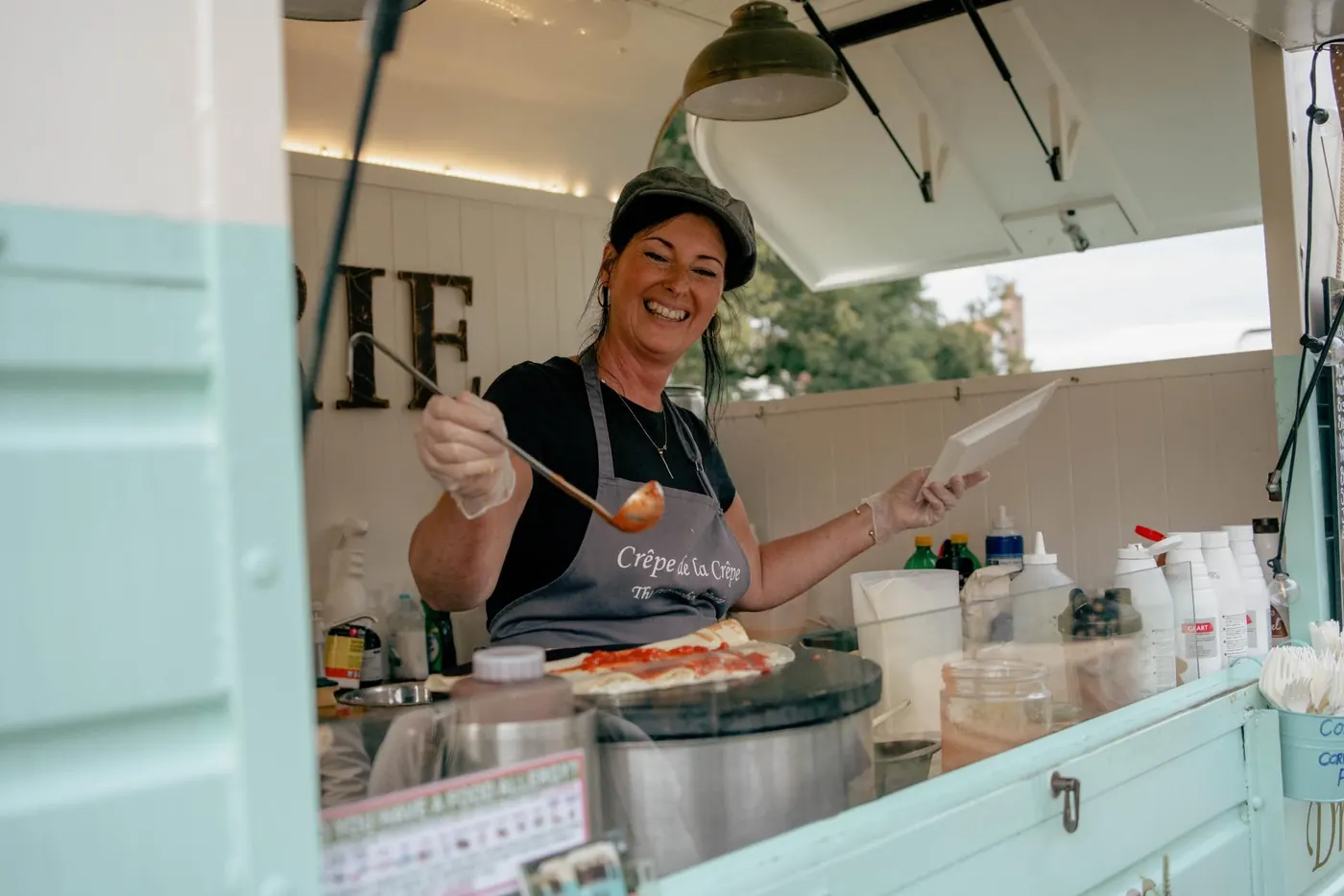 Street food van serving crêpes at a garden wedding