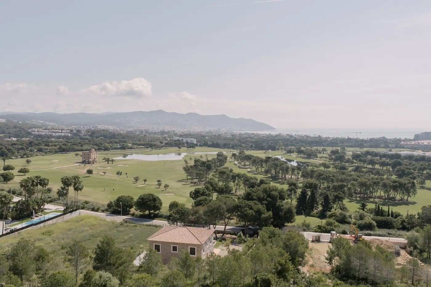 View across green countryside and mountains from a bridal suite abroad