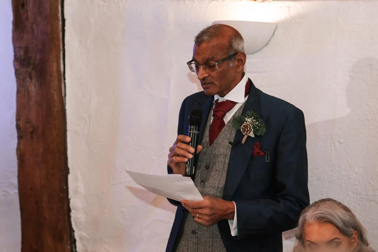 Father of the bride reading his speech