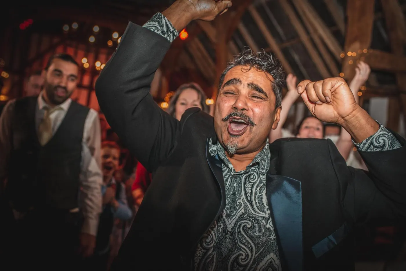 Guest dancing with his arms in the air