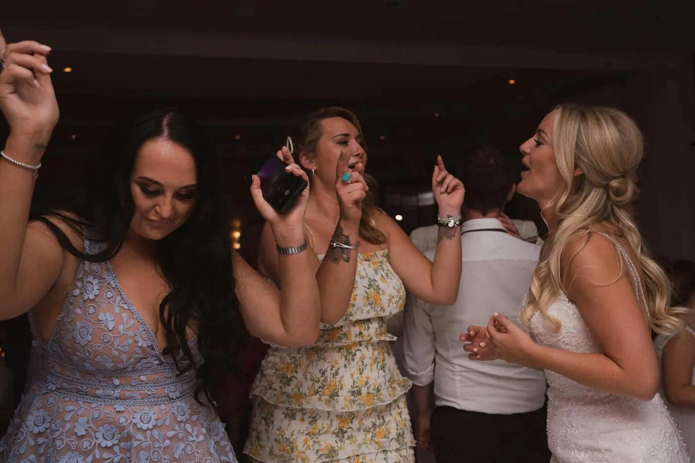 Guests dancing and singing along in the evening