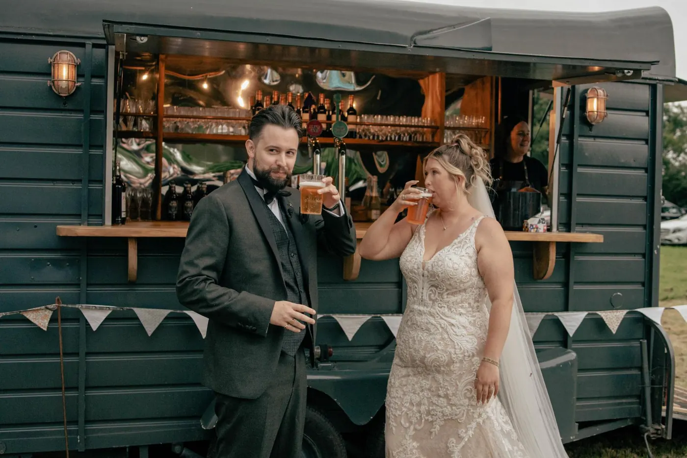Couple chatting at a horsebox bar during the drinks reception