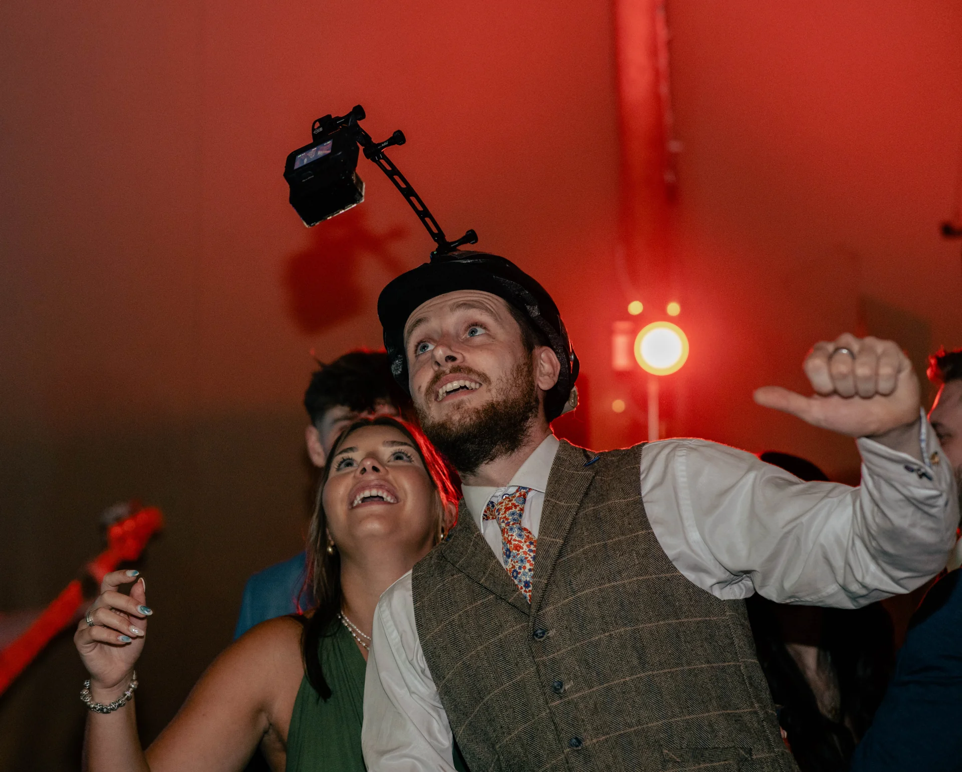 Wedding guests enjoying the helmet camera in the marquee