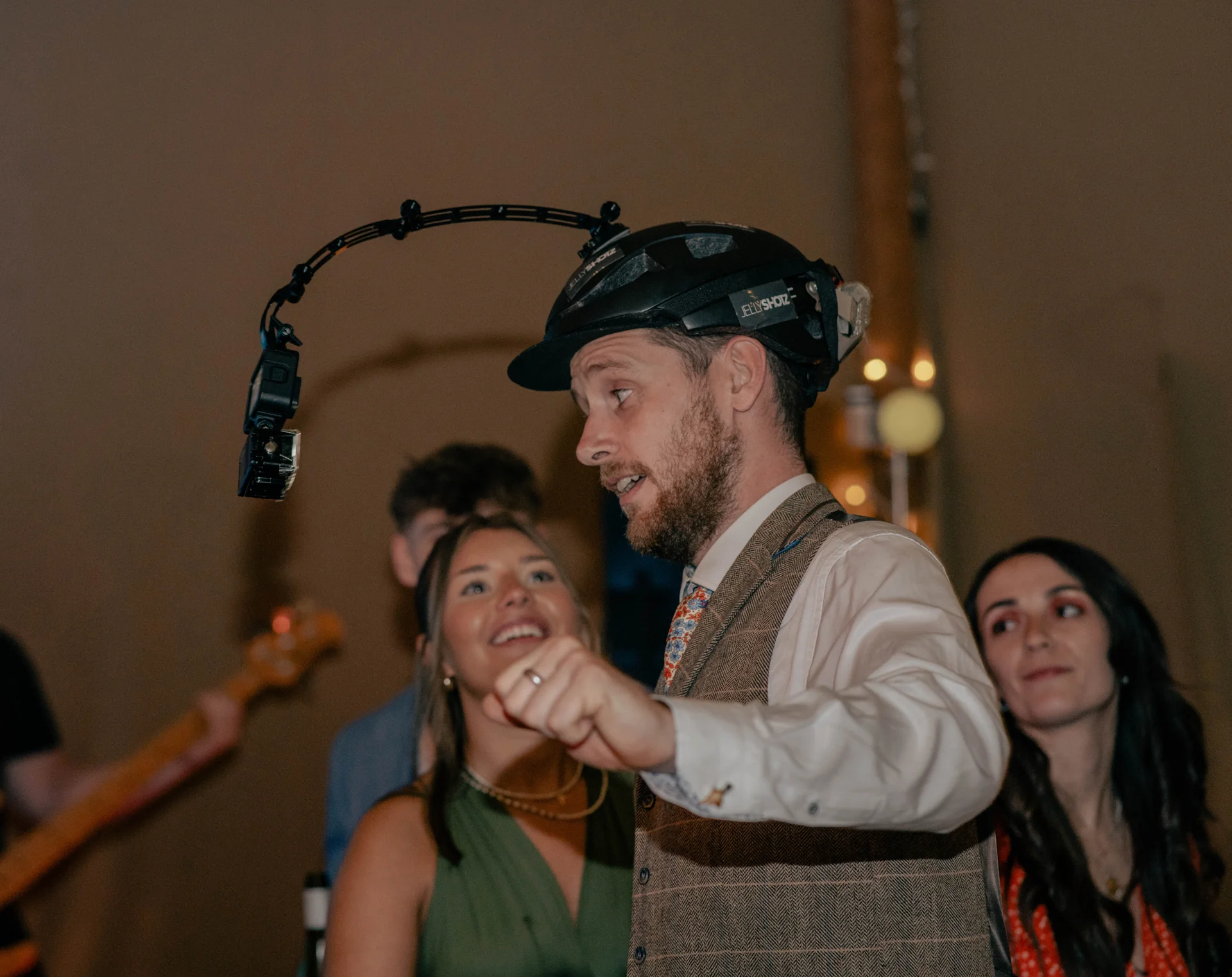 A wedding guest dancing while wearing the helmet camera