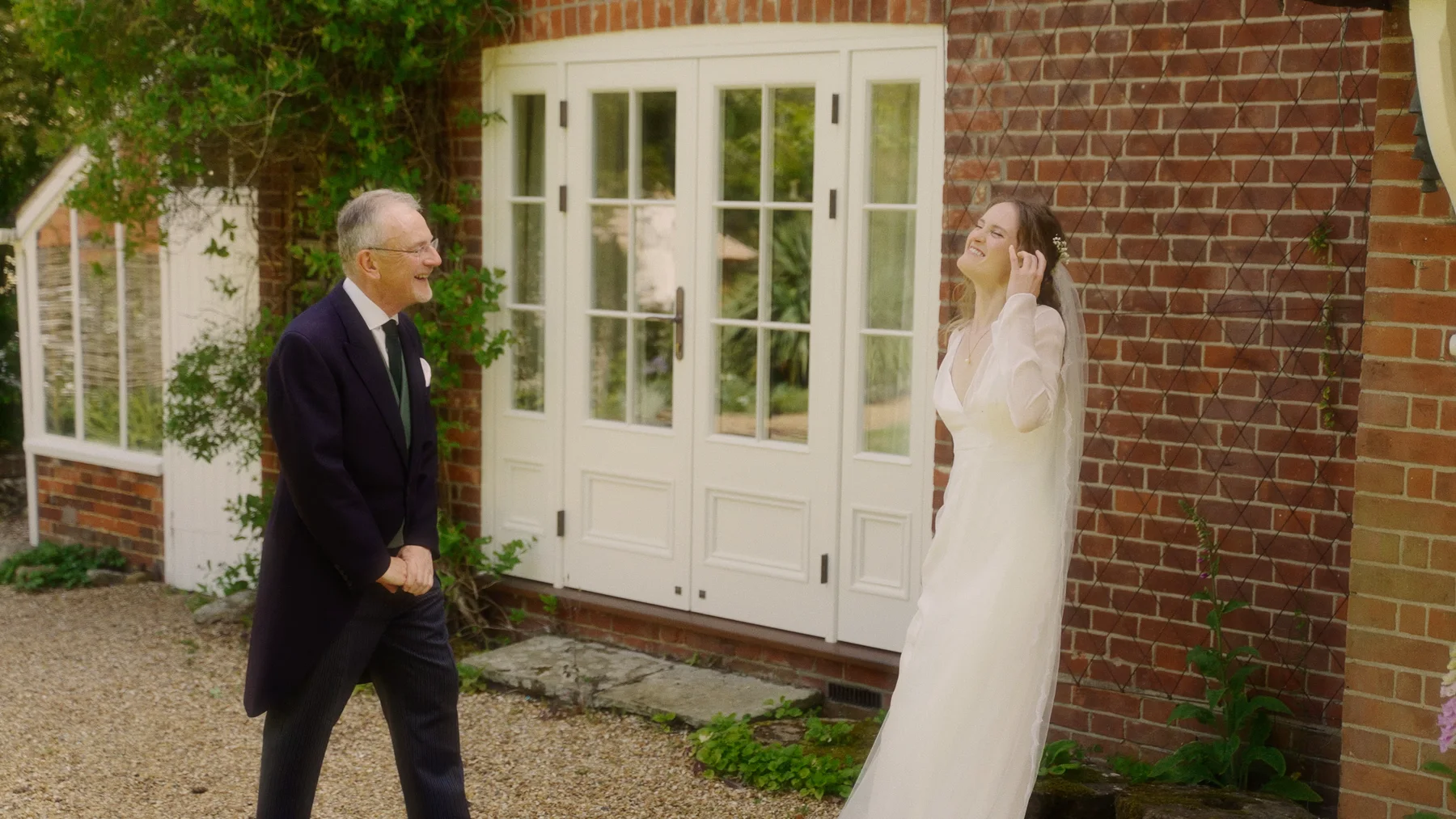 Charlotte and her dad seeing each other outside before the ceremony