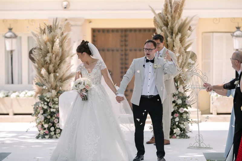 Ellie and Ernie walking out together after their outdoor wedding ceremony