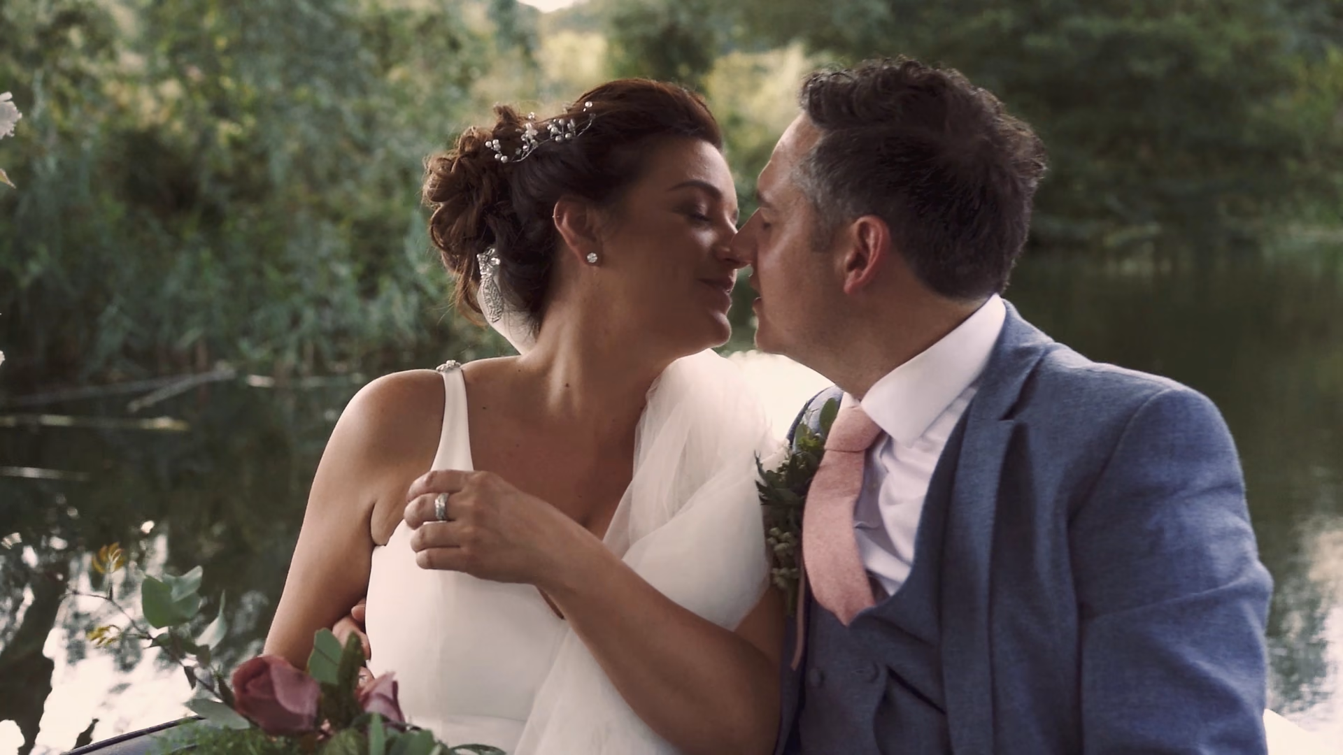 A kiss on the boat between the ceremony and reception — film still